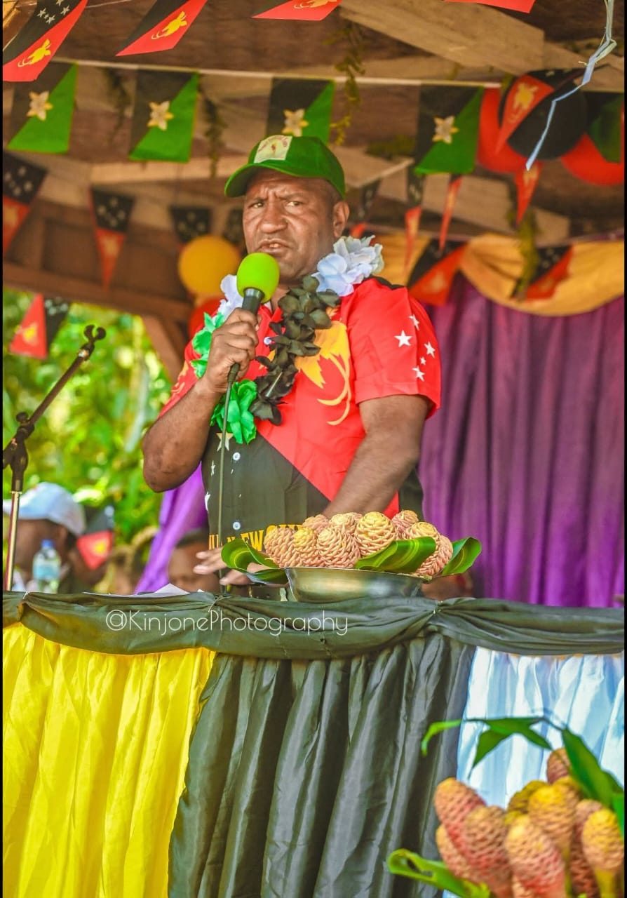 Speaker at the decorated stage, Poketamanda