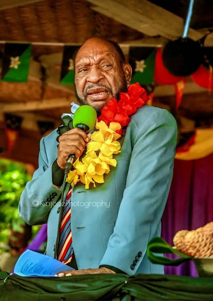 Guest speaker with flower garland at the event