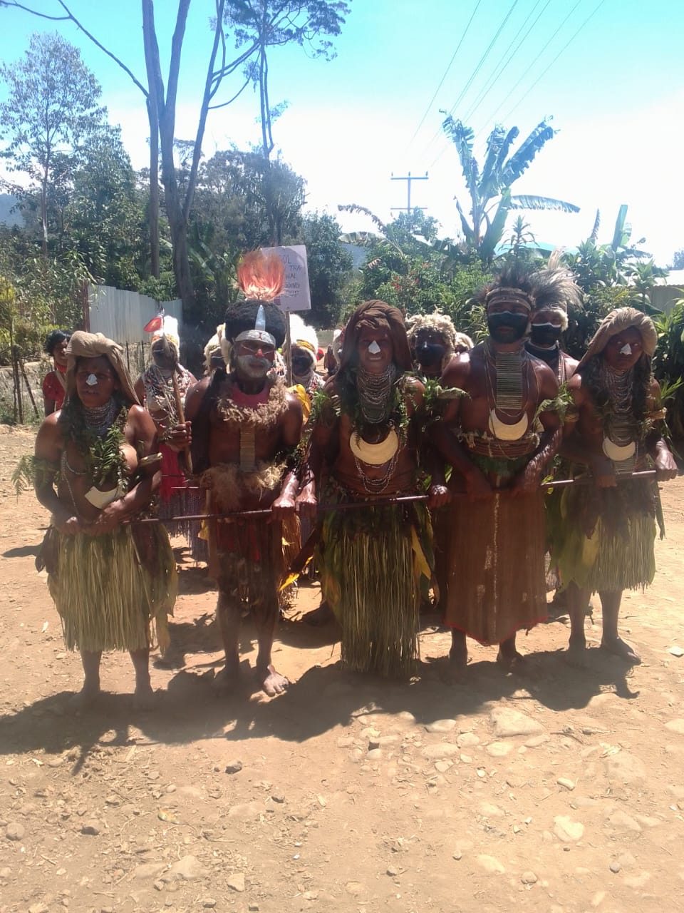 Women and girls in traditional bilas at Poketamanda